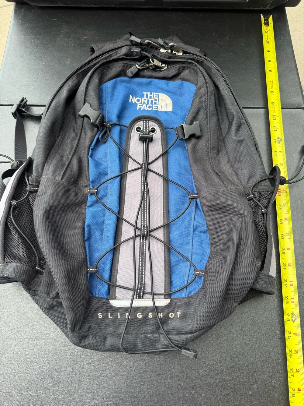 The North Face Slingshot Backpack in Black and Blue